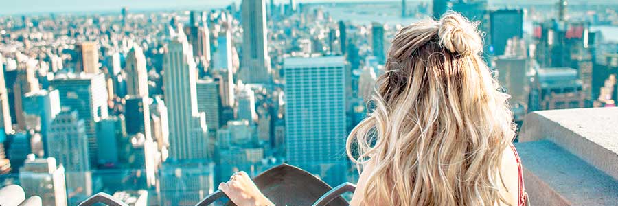 Girl looking at New York Skyline from the Rock